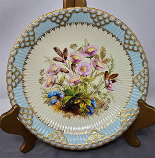Royal Crown Derby Floral Plate Gold & Jewels 1884: Exquisite cabinet plate from Royal Crown Derby. It is floral decorated with a gold chain border and purple jeweling on a ribbed pattern molded blank. Gold and platinum highlights are incorporated in