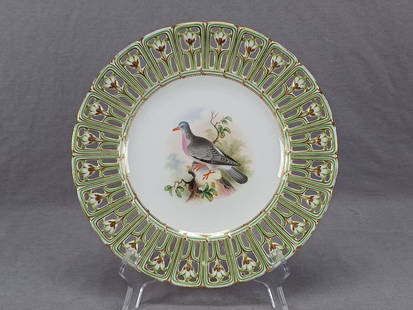 Minton Hand Painted Bird Green Reticulated Plate: Antique British bone china plate in the "Devon" shape with reticulated / pierced floral edge in green with gold highlights. Has a hand painted bird in the center. Unmarked except for the title "The
