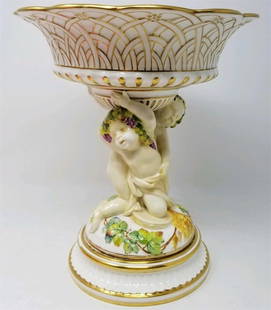 Large Classic Style Compote by Minton: Exquisite compote made by Minton for Gilman Collamore & Co of New York. The large bowl is being held up by two cherubs and surrounded by grapes and sheaves of wheat. The bowl is in excellent