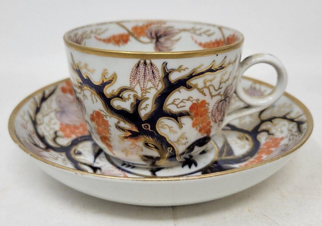 English New Hall Tea Cup & Saucer 18th Pattern 446: English New Hall Porcelain Tea Cup & Saucer in the Imari Vine Pattern (446). The cup is 2 7/8 inches tall and the saucer is 5 1/2 inches across. No chips but there is a star crack on the underside of