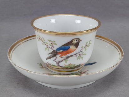 La Courtille Paris Hand Painted Bird Cup & Saucer: Antique French porcelain cup and saucer. Decorated with a hand painted berry on a branch with small red berries. The saucer also has a small dragonfly. Double gold gilding along the edge. Marked on th