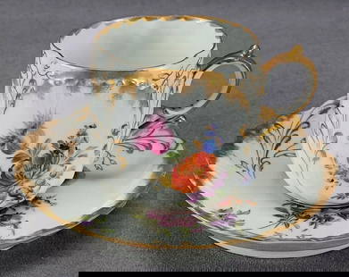 Wolfsohn Dresden Hand Painted Cup & Saucer A: Nice antique late 19th century porcelain cup and saucer with floral scrollwork relief molded design with gold gilt highlights. Hand painted with pink, purple, blue, yellow, and orange flowers. Gold gi