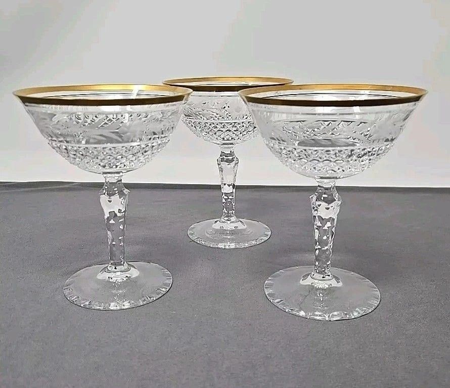 Set 3 Ebeling & Reuss Marquis Champagne Glass 5": Set of three very good condition coupe champagne glasses by Ebeling & Reuss in Marquis pattern. Etched floral design over raised diamond cut bowl. Measures approximately 5 inches tall and 4 inch diame