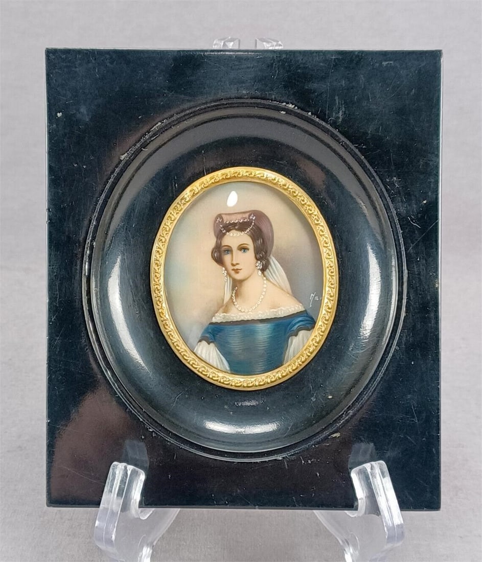 19th Century Hand Painted Miniature Lady Portrait: Nice antique late 19th century hand painted miniature of a brunette lady with a pink and white headdress and a blue gown. The portrait is signed by the artist. Has a lacquered black wood frame.Has som