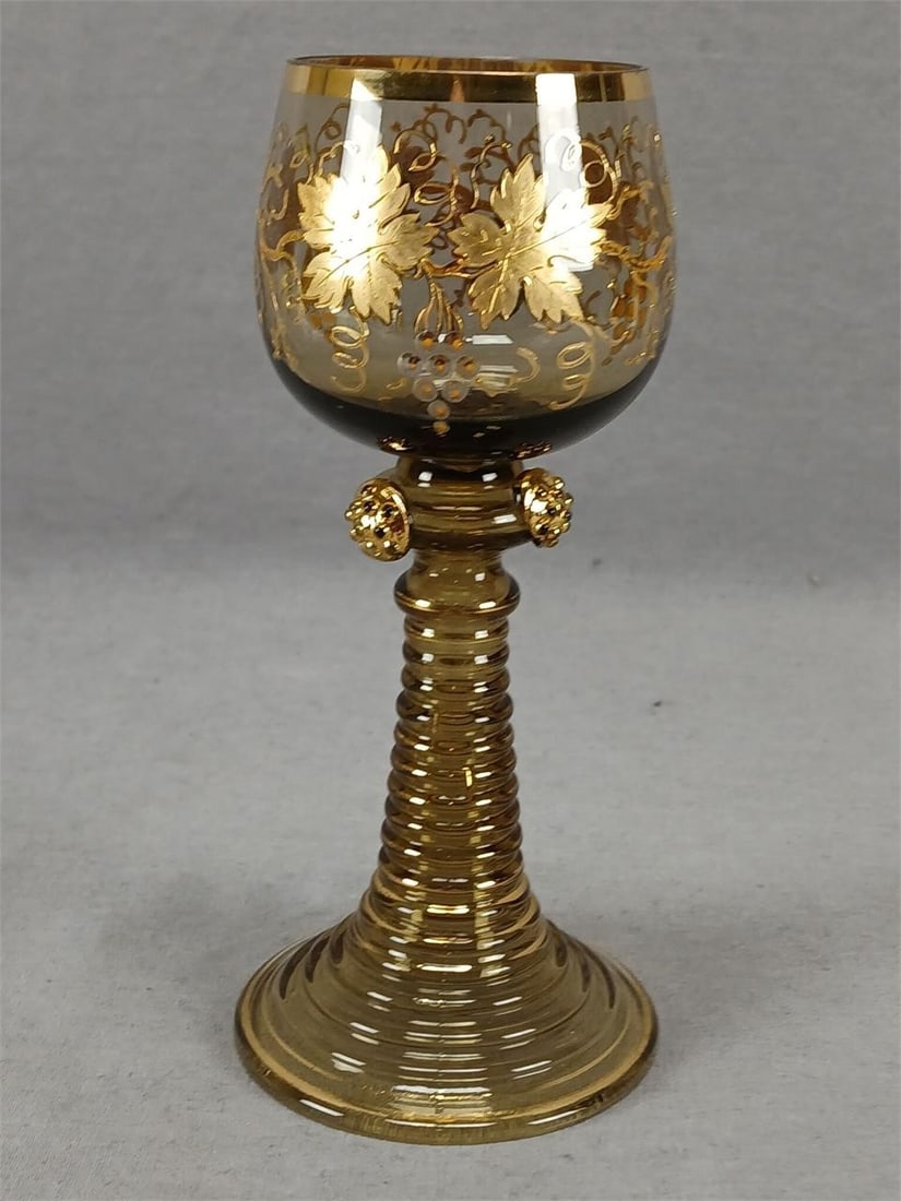 Antique Bohemian Grapevine Amber Hock Wine Roemer: Antique Bohemian blown amber glass hock wine roemer. With raised gold and orange enamel grapevine around the bowl. Gold gilding along the rim. Gold gilding to the applied prunts on a knop above a holl