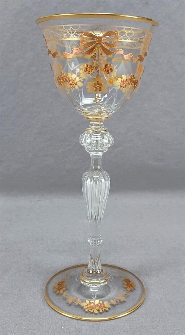 Josephinenhutte Gold Floral Swags Bows Wine Glass: Nice antique hand blown clear glass hock wine. Decorated with a band of gold fishscales with raised gold bows and gold floral swags. Signed Josephinenhutte on the base. Circa 1923.Has some wear to the