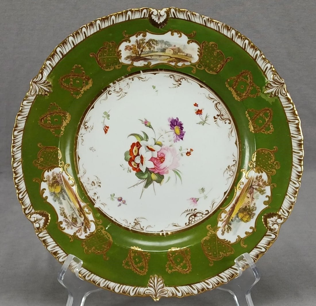 Coalport Hand Painted Floral Landscape Plate A: Antique British bone china plate in Coalport's Union shape. Decorated with a hand painted pink rose and purple, white, and red-orange flowers in the center framed by gold scrollwork. Has a white green