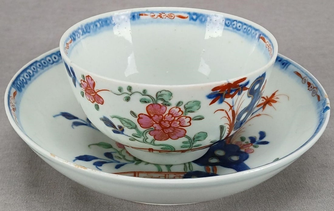 Lowestoft Blue Bomb Pattern Tea Bowl & Saucer: Antique British Lowestoft porcelain tea bowl and saucer in the "Blue Bomb" pattern. Unmarked. Circa 1775.Has some wear consistent with age and use, wear to the gilding, a small chip to the the back ed