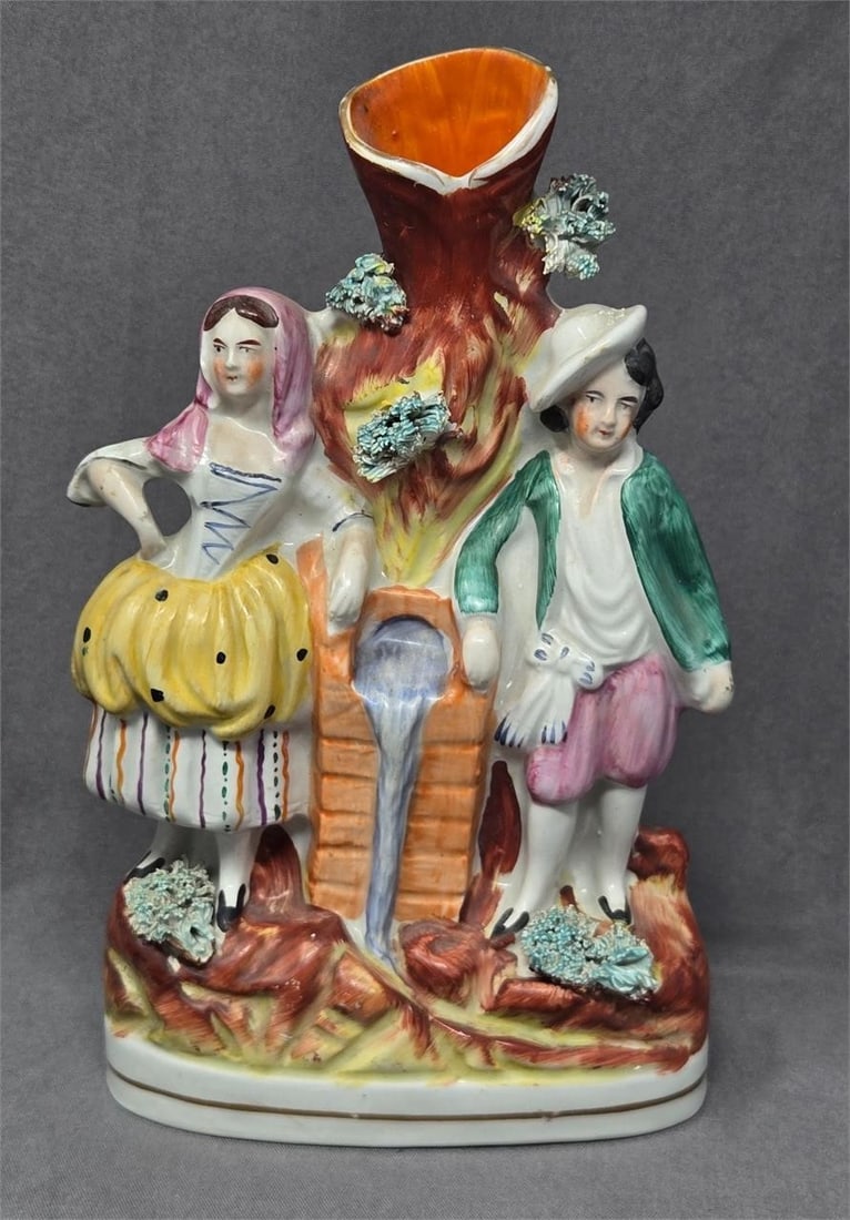 Staffordshire Spill Vase Couple at a Well C. 1860: Staffordshire England spill vase with a hand painted couple at a well. Influenced by the Metropolitan Water Act of 1852 that declared fresh water for all to improve health conditions in England. Measu