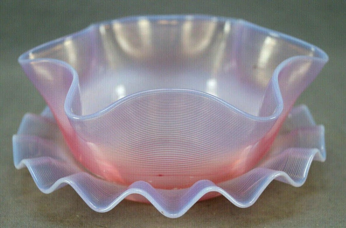 Cranberry Threaded Opalescent Glass Bowl & Plate: Bohemian opalescent finger bowl with overall applied fine cranberry ribbing. With ground and polished pontiled base. Comes with matching under plate. Circa 1890s.Has numerous small chips to the applie