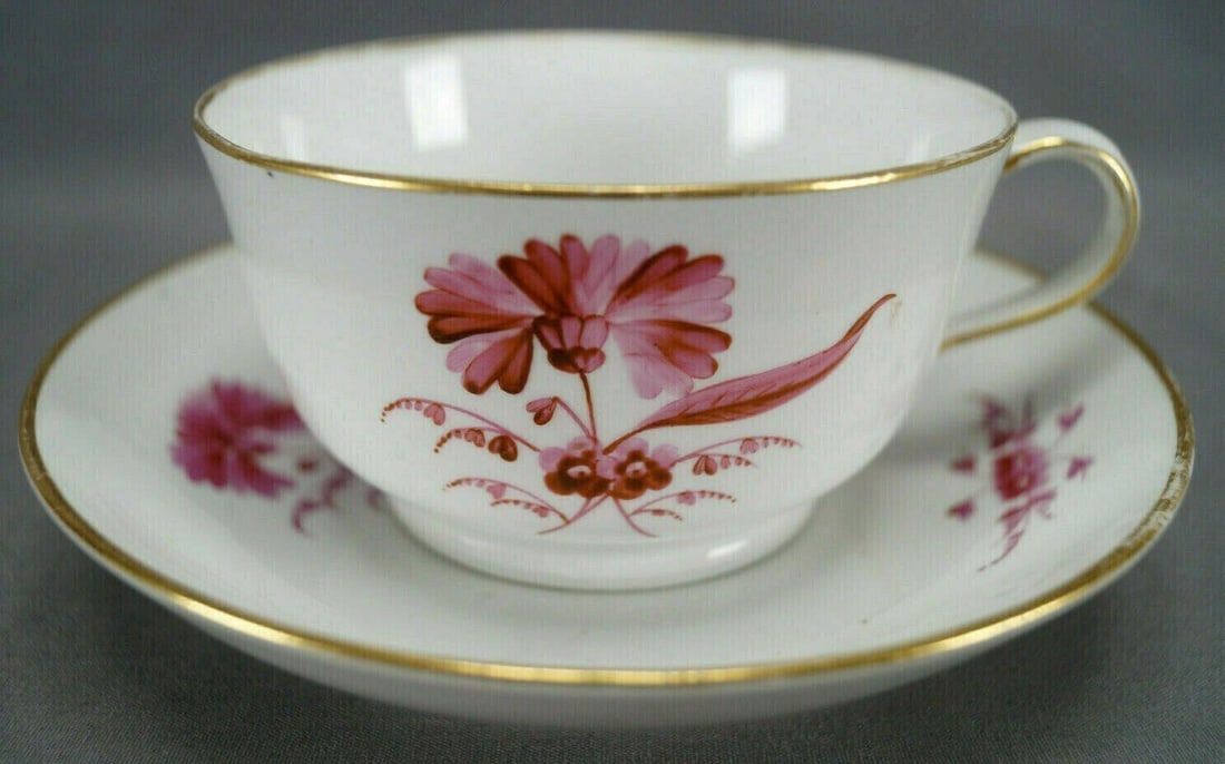 Derby Oversized Cup & Saucer C. 1782-1800: Nice porcelain oversized cup / breakfast cup and saucer. Decorated with hand painted puce flowers. With gold gilding along the rim. Marked on the bottom with a puce Derby mark used between 1784 and 18