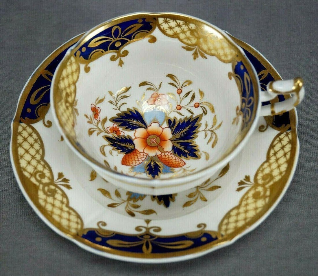 Minton Imari Pattern Tea Cup & Saucer C.1824-30 A: Nice bone china tea cup and saucer in Mintons N shape. Decorated in the Imari / Japan type pattern with hand painted floral design in red, blue, cobalt and gold. Cobalt and yellow designs along the ed