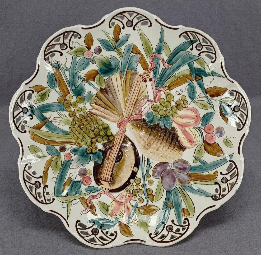 Rudolf Ditmar Hand Painted Majolica Cake Stand: Nice antique cream colored faience majolica earthenware reticulated cake stand. Decorated with a hand painted fruit and mandolin pattern. Cobalt blue around the stem. With brown trim. Has an impressed