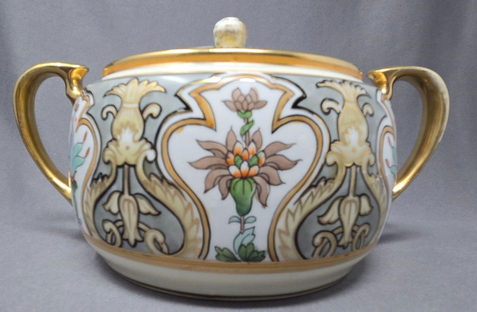 Nippon Murimura Large Sugar Bowl Art Nouveau: Hand Painted Morimura Brothers large sugar bowl in the Art Nouveau style. Circa 1911- 1921. Measures approximately 4 3/4 inches tall and 9 1/4 long from handle to handle and 6 1/2 inches wide. No chip