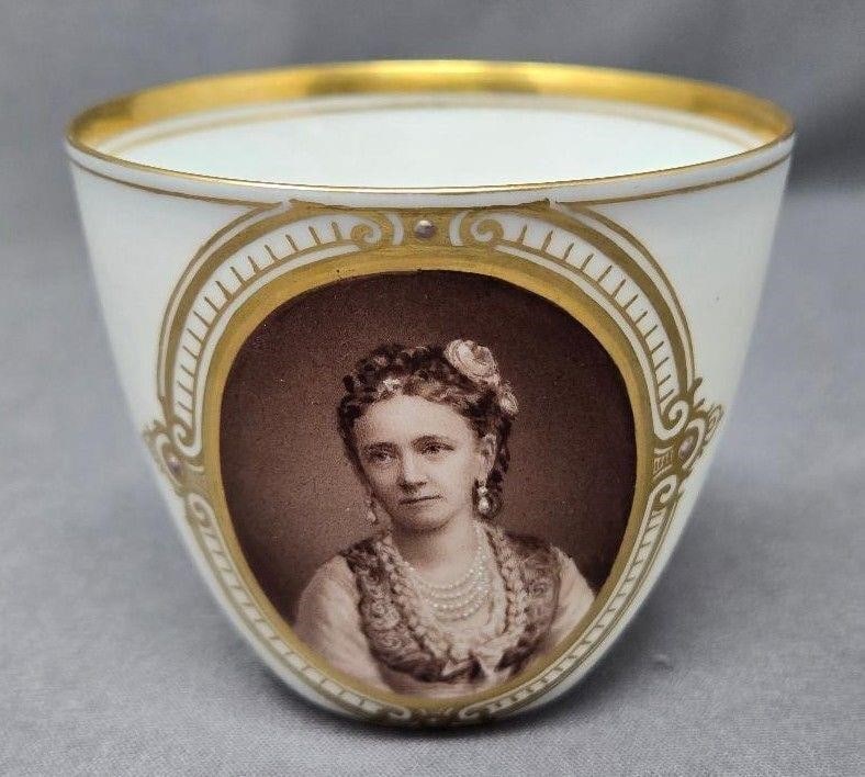Royal Copenhagen Portrait Cup - Queen Louise ?: Antique porcelain cup mage by Royal Copenhagen of Denmark. It has a sepia toned portrait of a woman, possibly Queen Louise of Denmark. It measures 2 1/2 inches high and 2 3/4 inches in diameter. There