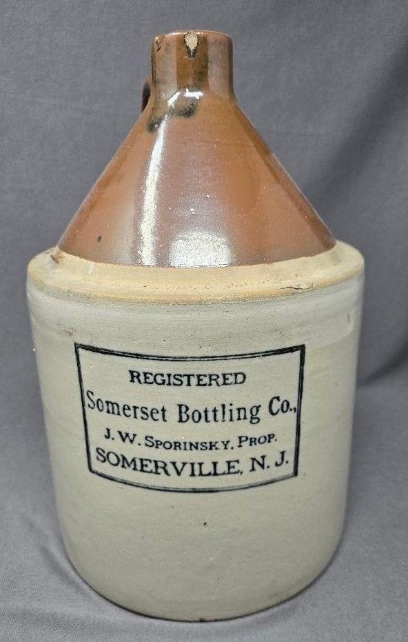 Somerset Bottling Co. Advertising Jug - New Jersey: Somerset Bottling Company advertising jug. They were located in Somerville, New Jersey. The jus stands approximately 11 inches high and is 7 inches in diameter at the base. There are no cracks, but th