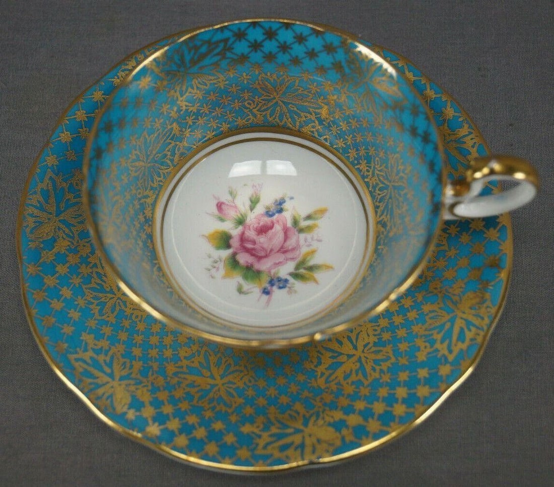 Aynsley Pink Rose Turquoise Tea Cup & Saucer: Beautiful vintage porcelain bone china tea cup and saucer. Decorated in the C980 pattern with a pink rose and small blue forget me not flowers in the center. With a wide turquoise border with gold gil