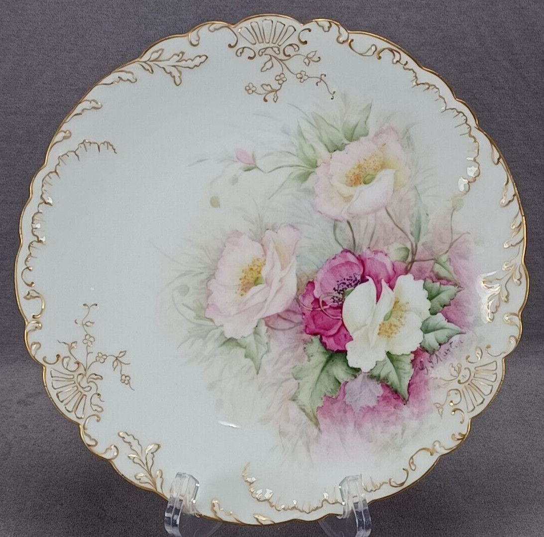 Limoges Hand Painted Signed Pink Poppies Plate: Nice antique French porcelain plate. Decorated with hand painted dark pink, light pink, and white poppies over a pink an white background. With relief molded and gold highlighted floral scrollwork bor