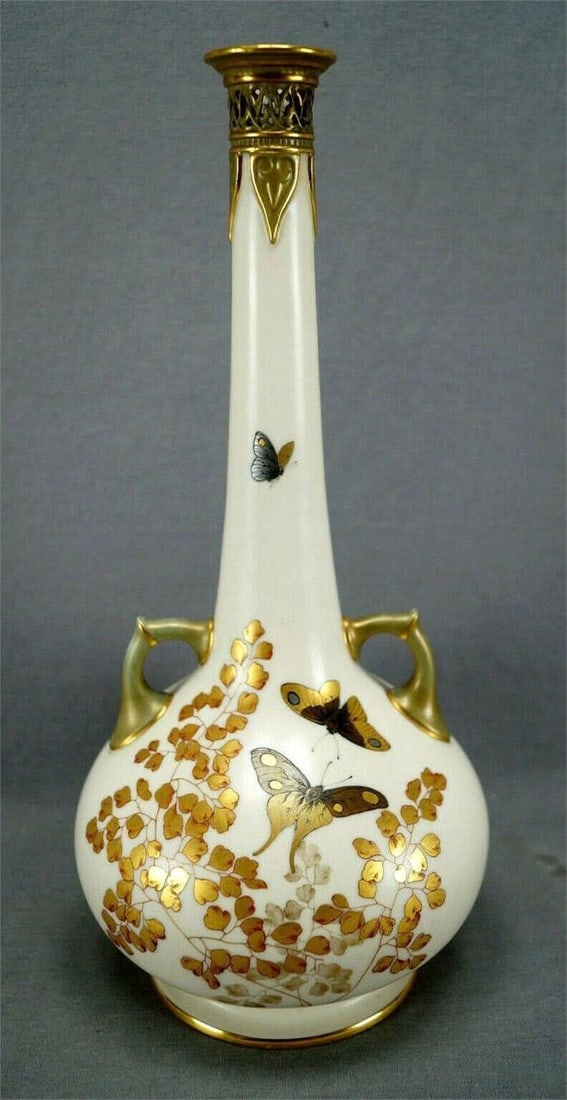 Royal Worcester Gold & Platinum Blush Ivory Vase: Nice antique late 19th century blush ivory porcelain vase. Decorated with hand painted butterflies, dragonflies, and gold leaves. Reticulation along the top of the neck. Marked on the bottom with the