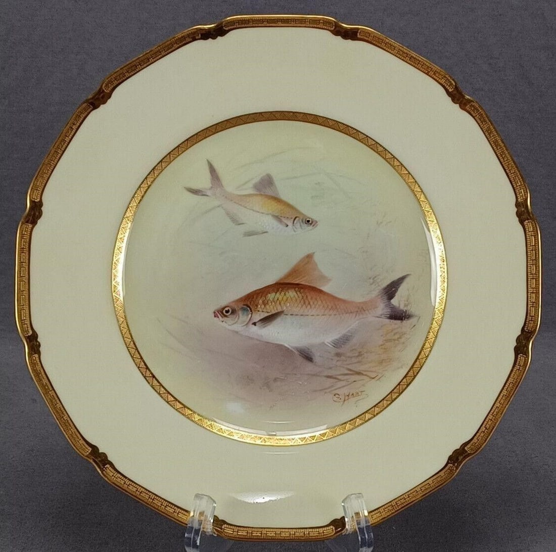 Royal Doulton HP Signed C Hart Fish 8 7/8" Plate: Nice antique British bone china plate. Decorated with a hand painted plate with two Bream fish. With gold encrustation along the inner rim and edge of the plate. Pale yellow border. Marked on the reve