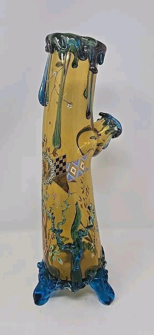 Harrach Enameled Glass Vase Amber & Blue C1890 #1: Antique Harrach applied glass and enamel decoration trunk vase. Hand blown amber glass curved trunk with applied blue glass curling roots as feet and side design with a branch on side. Hand enameled w