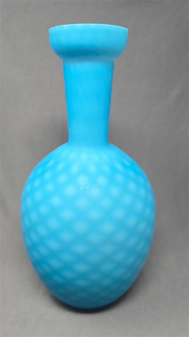 White Cased Blue Glass Quilted Pattern Vase 12": Late 1800s blue glass vase. White diamond quilted pattern on blue with white cased inside. Satin glass. Measures approximately 12 1/4 inches tall and 6 1/4 inches wide. There are some marks on the gla