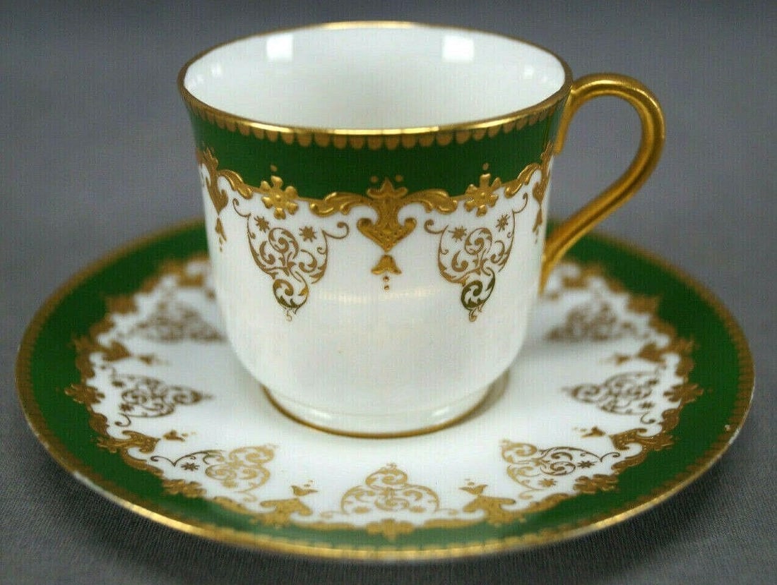 Coalport Green & Gold Demitasse Cup & Saucer: Nice antique porcelain bone china demitasse cup and saucer. Decorated with a green border with gold scallops along the edge and raised gold scrollwork along the bottom of the green band above gold scr