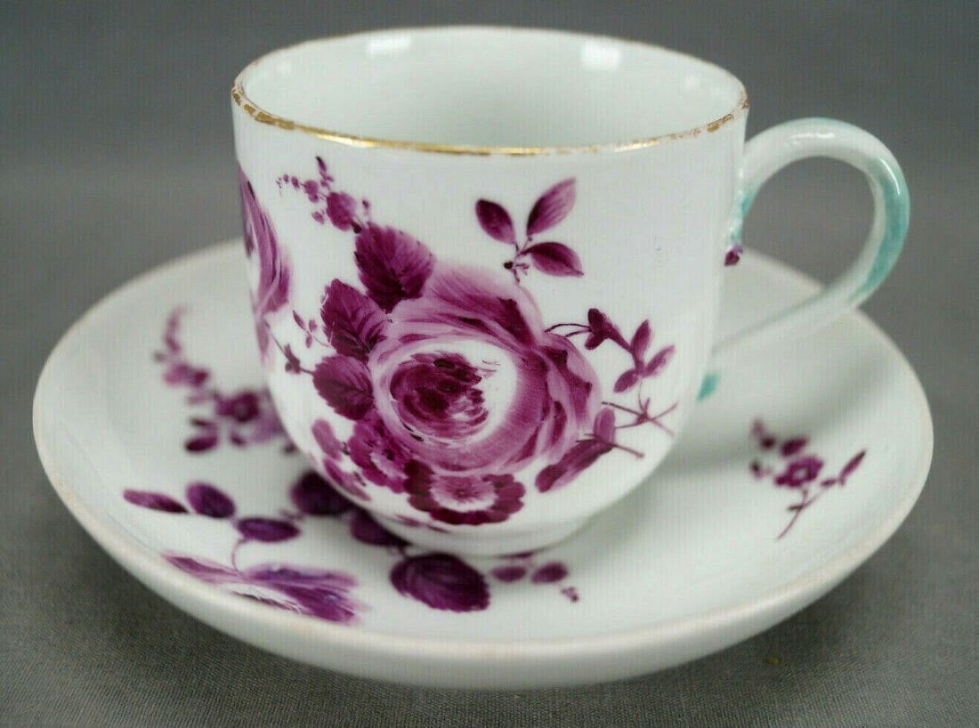 Meissen Dot Period Coffee Cup & Saucer C.1763-1774: Nice 18th century dot period porcelain coffee cup and saucer. Decorated with hand painted puce roses and flowers. Gold gilding along the edge of the cup. Blue highlights to the handle. Both pieces are