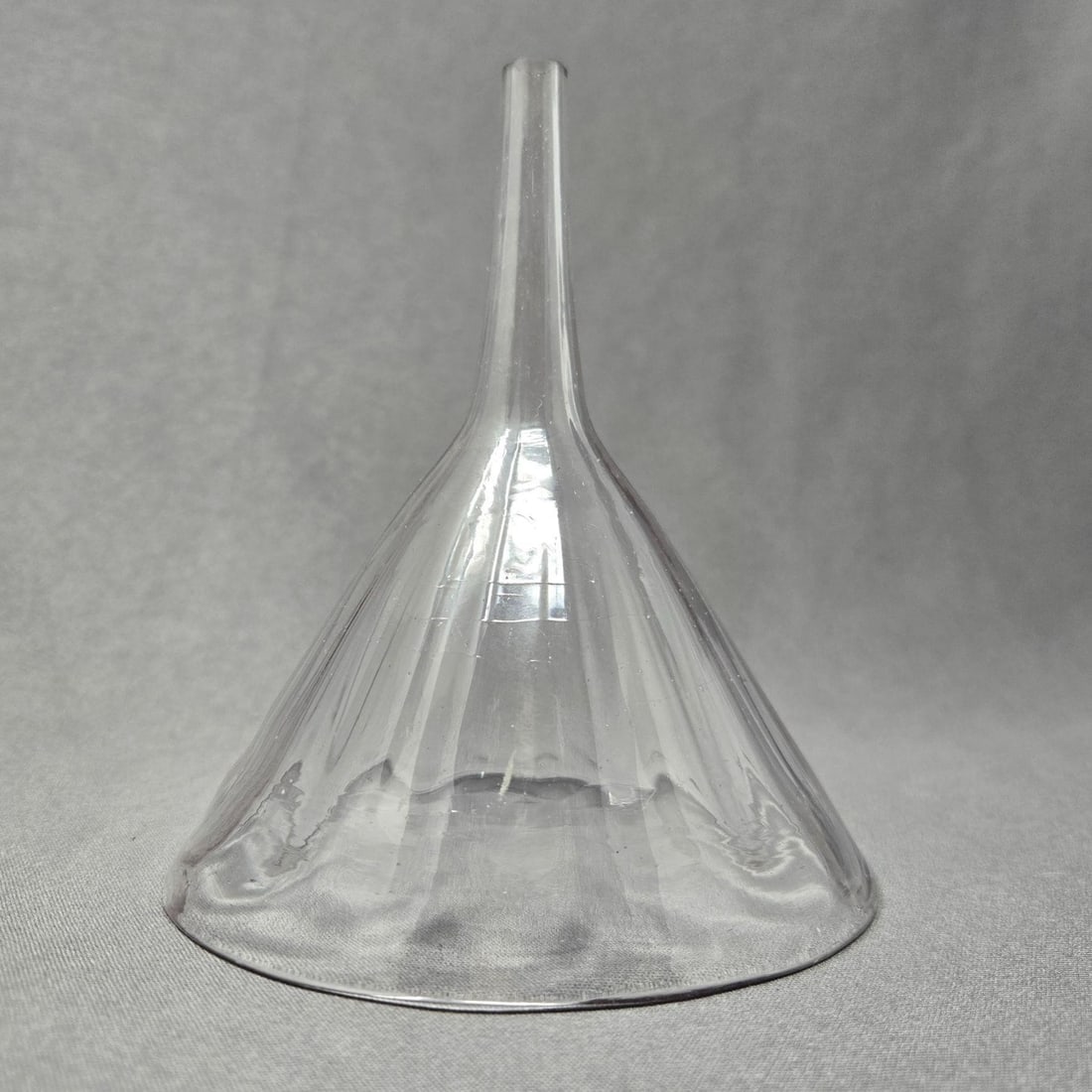Antique Midwestern Glass Funnel C. 1840's: Antique glass funnel from the Mid-western region of the United States. Glass has a pinkish hue and optic molding ribs on sides. Measures approximately 4 1/8 inches in diameter and 5 inches tall. There