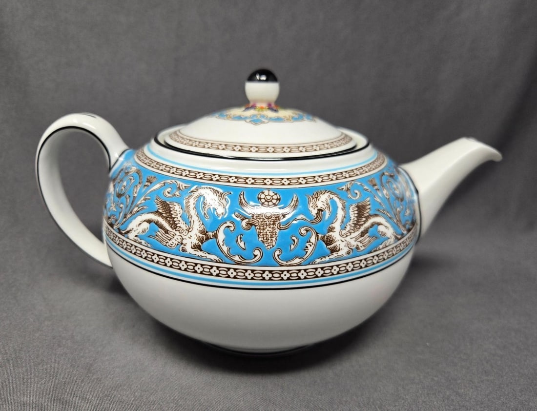 Wedgwood Florentine Turquoise Teapot: Wedgwood Turquoise Florentine with fruit medallion teapot. Very good condition with out chips, cracks, or scratches. There is some staining on inner spout. No wear to paint or glaze. Measures approxim