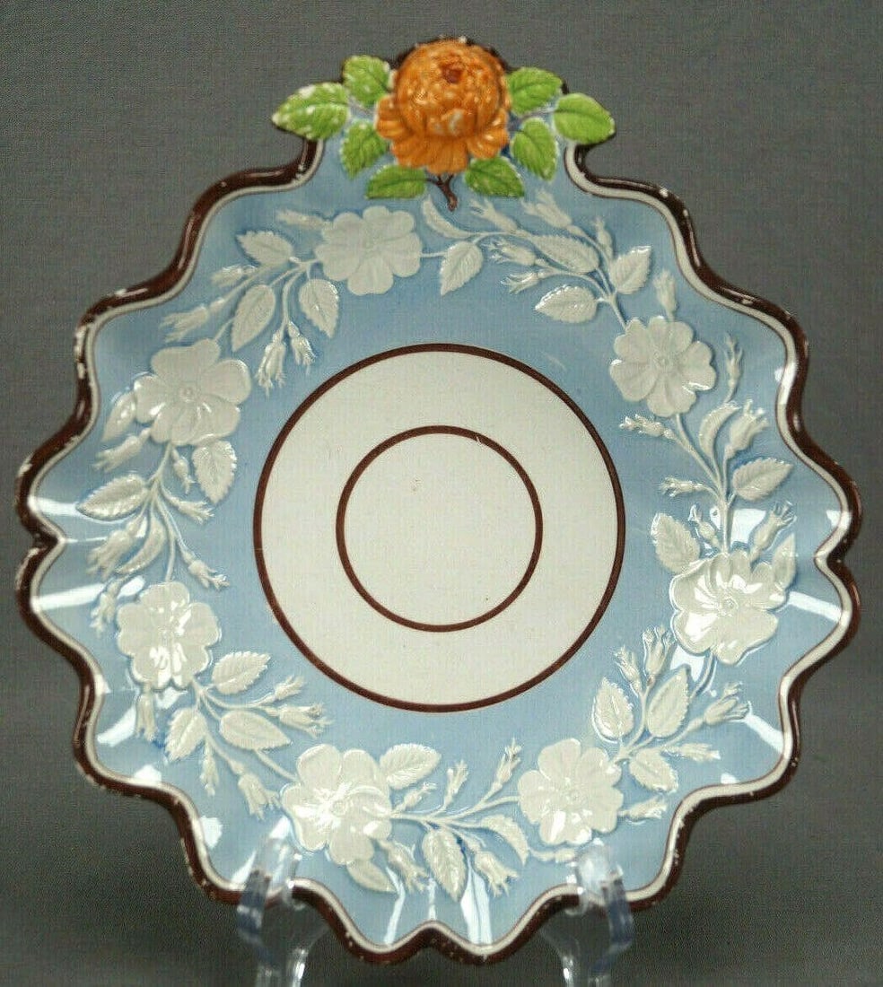 Ridgway 632 Pearlware Dessert Dish C. 1820 A: Rare pearlware dessert dish with rose blossom & leaf handle. Has an embossed white floral border over blue. With dark brown around the edge. Has orange and green highlights to the handle. Unmarked exc