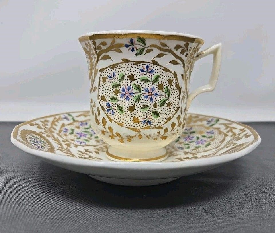 Copeland & Garrett 4901 Coffee Cup & Saucer: Copeland & Garrett Felspar pattern 4901. Rococo Style with pink and blue flowers with gold floral work and a dotted gold backdrop. Circa 1833 to 1847. Some loss to gold, especially where cup rests. No