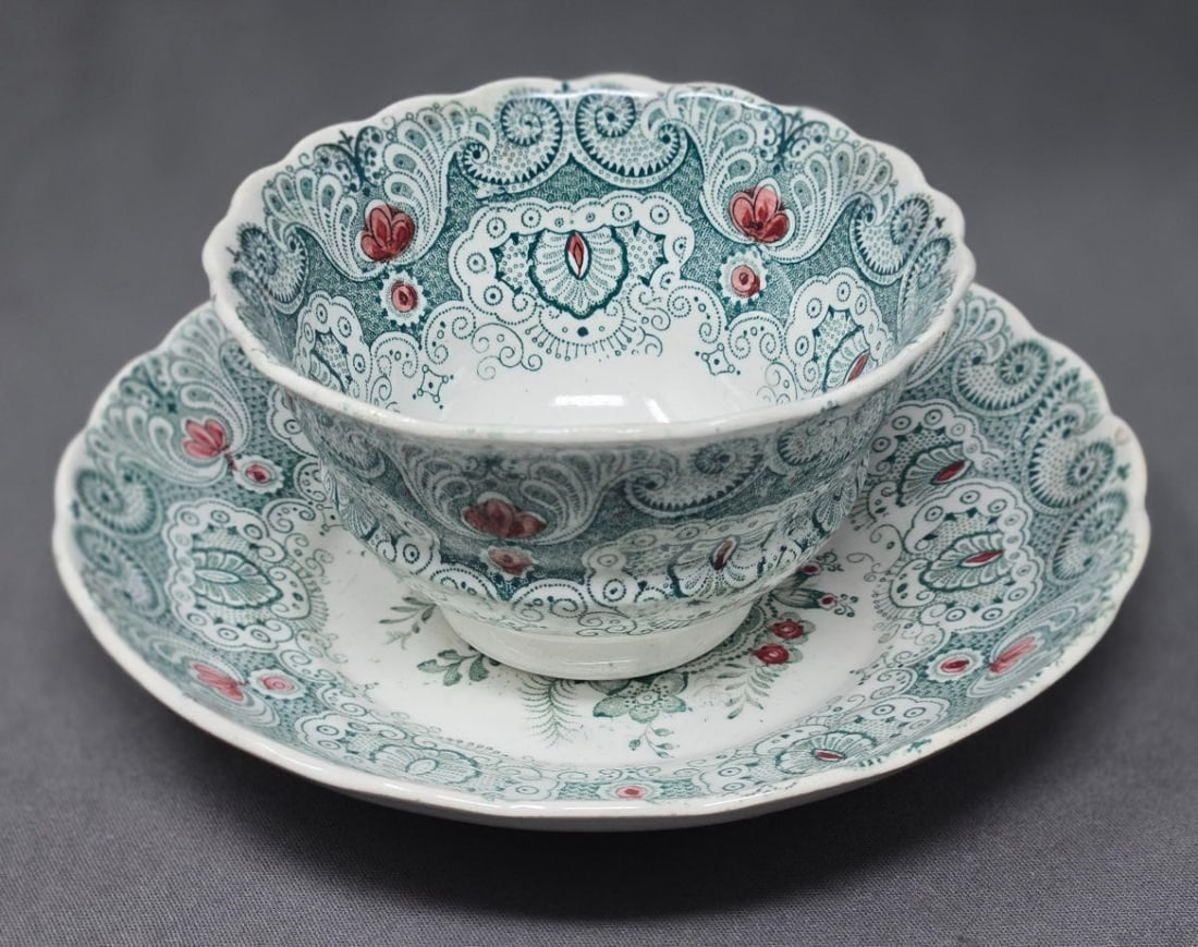 Wm. Adams IV & Sons Cup and Saucer: William Adams IV & Sons Featherily Lace #01 pattern. Green transferware with red painted accents. Scalloped edges. No chip or cracks or crazing. Circa 1829 to 1861. Approximate measurements: The sauce