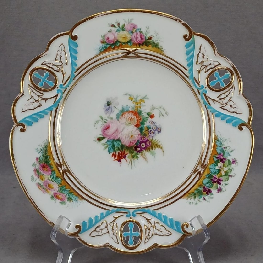 Minton Hand Painted Floral Pierced Plate E: Nice antique mid 19th century bone china plate. Pierced cross medallion and relief molded leaves and swags border with turquoise enamel and gold highlights. Decorated with a central hand painted bouqu