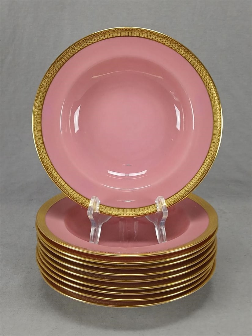 10 Lenox Pink & Gold Rimmed Soup / Salad Bowls: Set of 10 antique porcelain rimmed soup / salad bowls. Decorated in pompadour pink with a gold encrusted border. Marked on the bottom L Lenox with a wreath in green. This mark was used between 1906 an