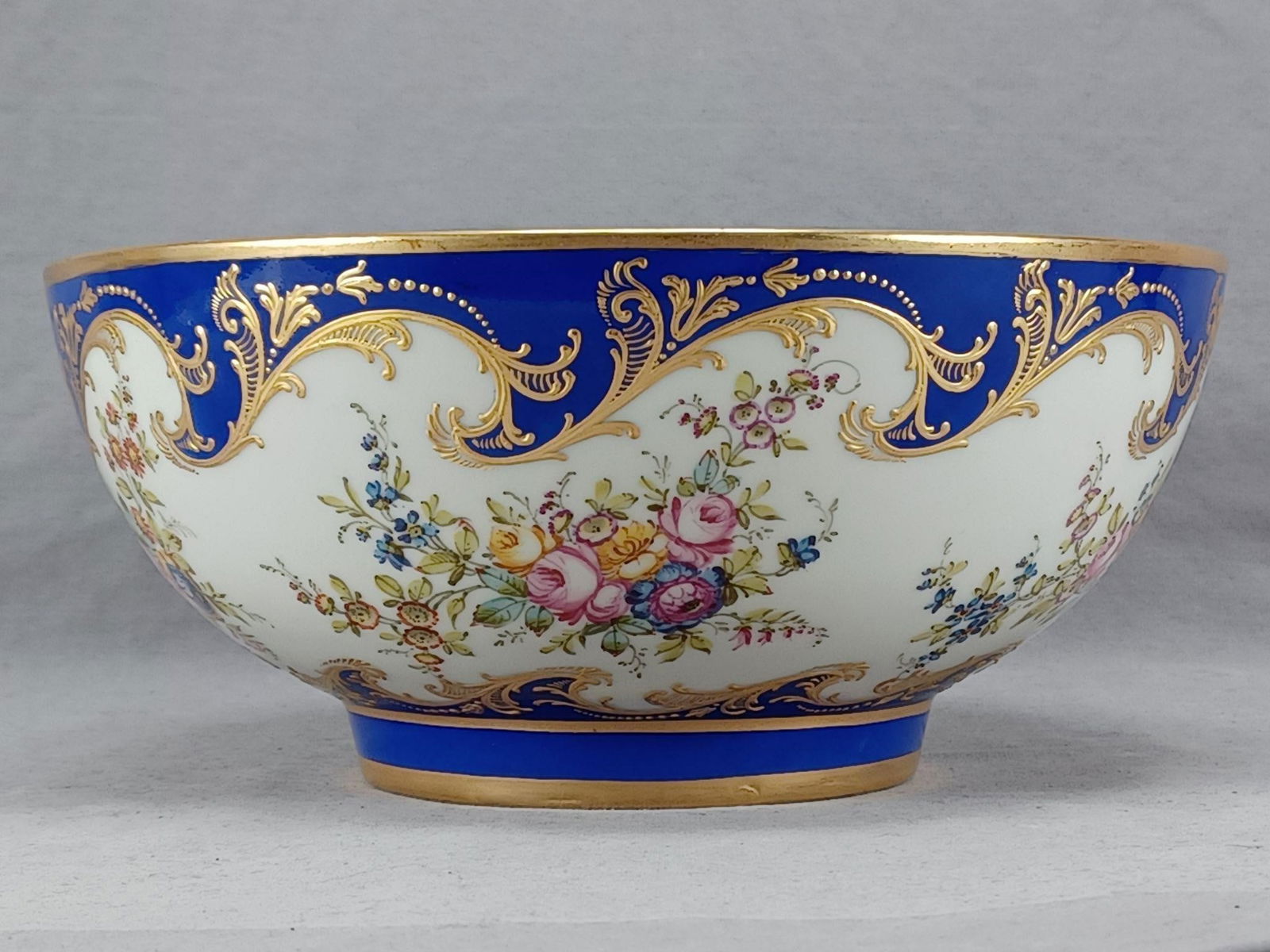 Achille Bloch Paris Floral & Gold 9 7/8 " Bowl A: Achille Bloch Paris Hand Painted Floral Raised Gold & Cobalt 9 7/8 Inch Bowl ANice antique French porcelain bowl. Decorated with a cobalt blue border with raised gold scrollwork and beads above and