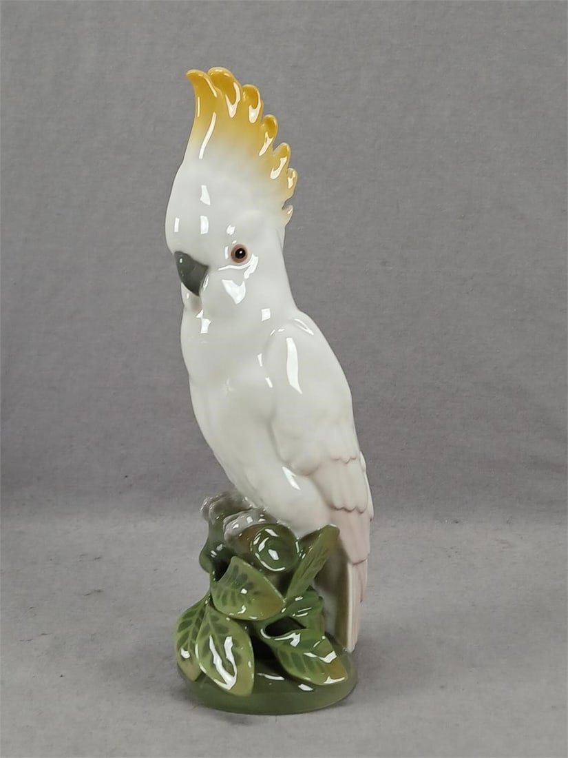KPM Berlin Cockatoo Bird Porcelain Figurine: 20th century German porcelain hand painted Cockatoo bird figurine. Marked on the base with the blue scepter mark and KPM mark used by KPM Berlin. Good condition. No chips or cracks. Measures