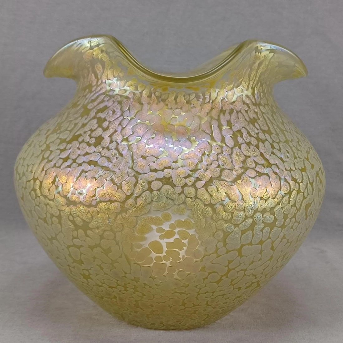 Loetz Candia Papillon 7 1/8 Inch Vase Circa 1900: Nice antique Bohemian blown clear glass vase with ruffled rim. Candia Papillon decor. Ground and polished pontiled base. Unsigned. Produced by Loetz. Circa 1900.Good condition.Measures approximately 7