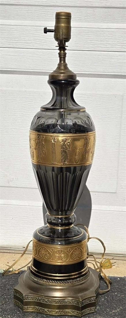 Val St. Lambert Smoky Glass Lamp with Gold Frieze: Very good condition glass lamp attributed to Val St. Lambert. Oroplastic blown glass lamp with gold frieze of Neoclassical Greek / Roman warriors. I'm not sure if it was originally an electric lamp or