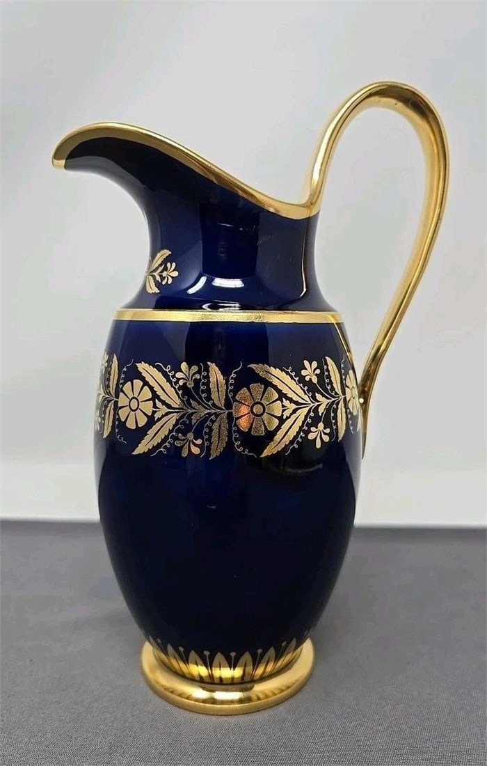 Sevres Cobalt Blue & Gold Floral Creamer / Jug: Hand painted Sevres tall creamer. Cobalt blue with a gold floral pattern band, flowers under spout and gold gilt handle, and edges. Excellent condition without chips or cracks. there is minor wear to