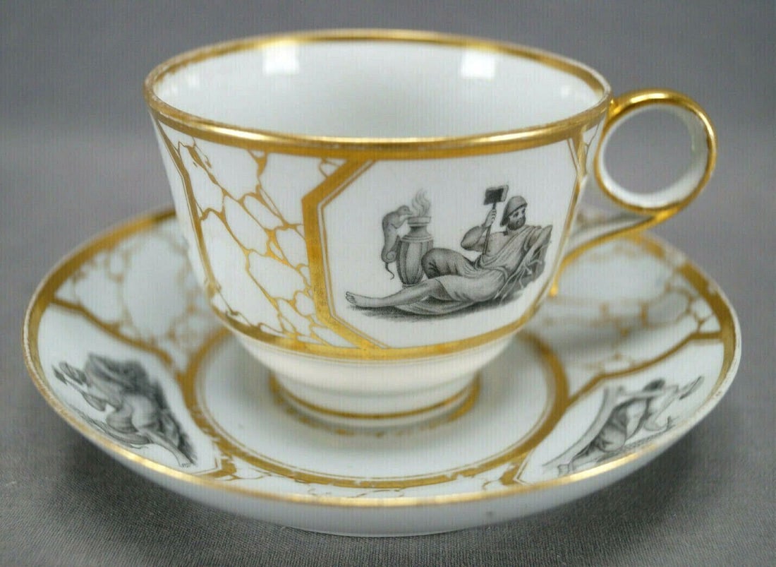 Flight Worcester Neoclassical Tea Cup & Saucer: Nice porcelain ring handle tea cup and saucer. Neoclassical decoration with bat print transfer scenes depicting Poseidon, Hera, and Hephaistos framed in gold gilding over a gold and white marbleized b
