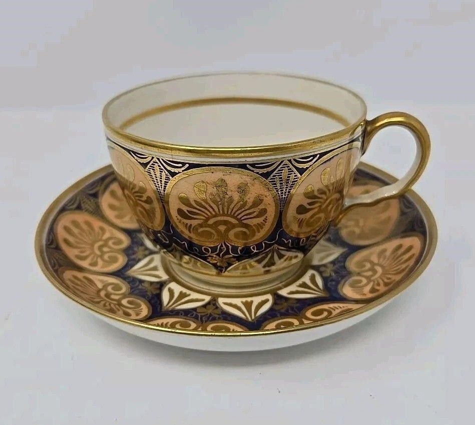 Ridgway Cup & Saucer c.1815 Pattern #396: Ridgway cup & saucer c.1815 - Pattern #396. The cup is 2 1/4 inches tall and 4 1/8 inches across at the handle. The saucer is 5 1/2 inches across. The saucer has no chips. The cup has a 1 inch crack t