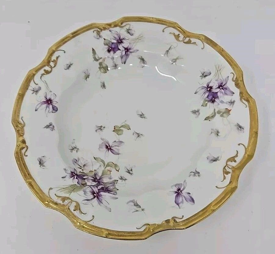 Limoges, Lewis Straus & Sons Coiffe Bowl Violets: Hand painted violets on a Limoges Coiffe blank and decorated by Lewis Straus and Sons. Decorated with violet bouquets and a heavy gold border. Very good condition without chips or cracks. There are so