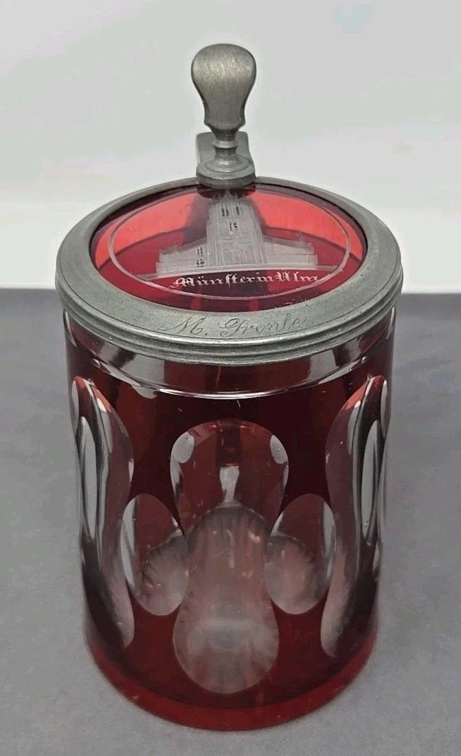 Ruby Stained Cut Glass Stein Ulm Germany: Munster in Ulm, Gothic church located in Ulm Southern Germany. Ruby stained and clear cut glass stain. It's not marked, but it looks to be1/2 liter. Measures approximately 4 1/8 inches to lip and 6 in