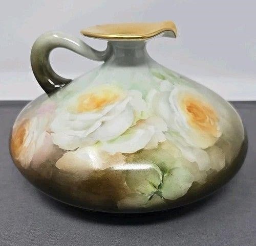 J P L Limoges France Vase Large White Roses: Jean Pouyat Limoges squat vase. Beautifully painted with large white roses on a forest green background. Measures approximately 4 5/8 inches tall and 7 inches wide. No chips or cracks. Circa 1890 to 1