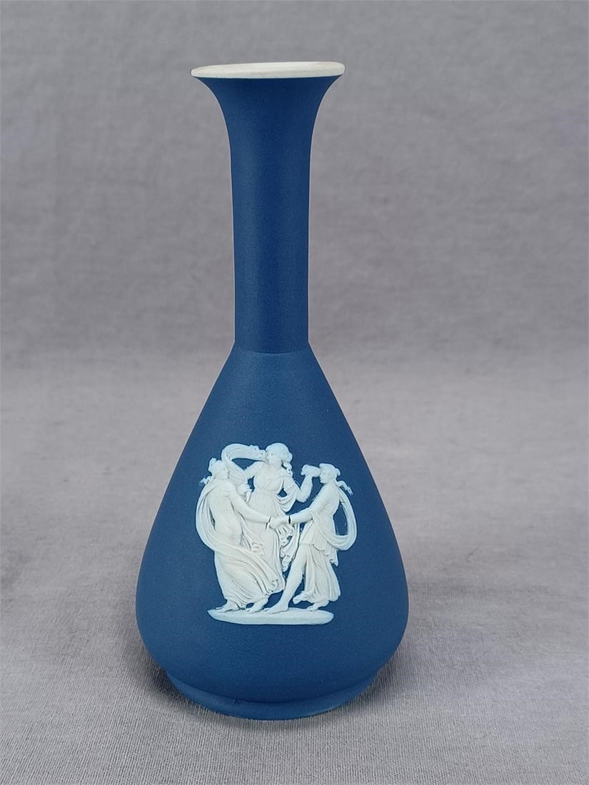 Antique Wedgwood Dark Blue Jasperware Vase: Antique British blue and white jasperware vase. White sprigged Neoclassical ladies on one side and Psyche Bound By Cupid on the other side. Has an impressed Wedgwood England mark on the base. This mar