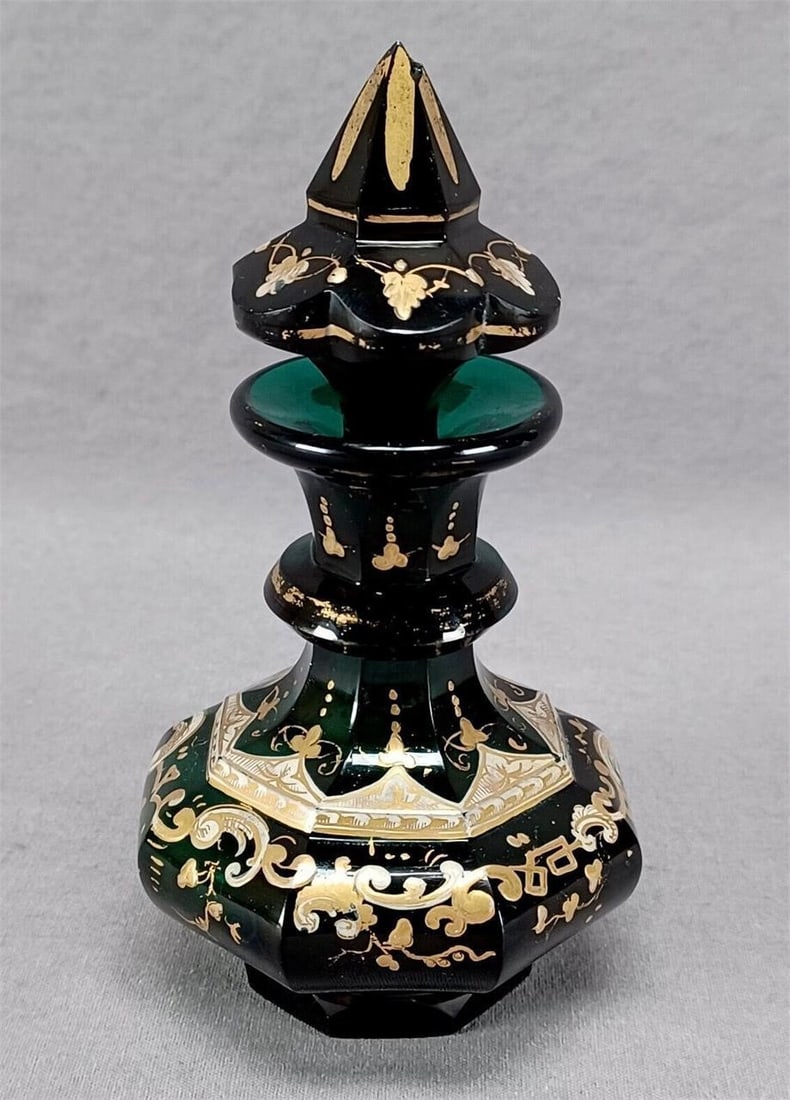 Mid 19th Century Bohemian Emerald Glass Perfume: Nice antique mid 19th century Bohemian emerald green hand blown and cut glass perfume bottle. With gold highlights and dots and hand enameled white and gold floral scrollwork enamel. Ground and polish
