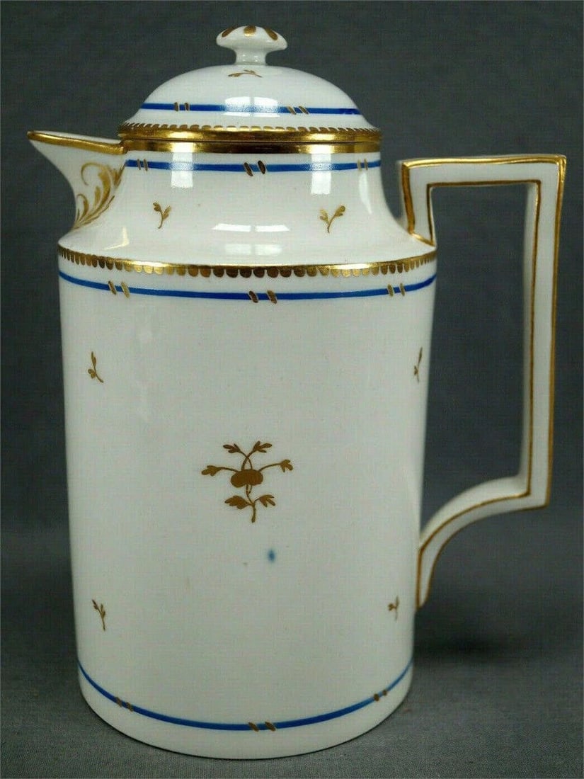 Royal Vienna Hand Painted Coffee Pot C. 1803: Rare authentic Royal Vienna porcelain coffee pot. Decorated with small hand gilded gold floral sprigs, blue bands with small gold lines, and scalloped gilding. With gold gilt leaf designs down the han