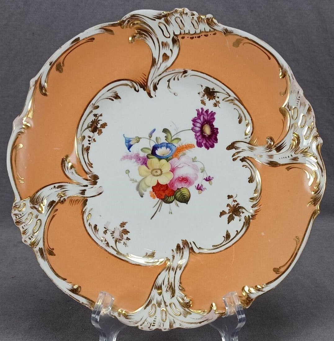 Grainger Worcester Painted Floral 9 1/4" Plate C: Nice antique British bone china plate in the New Dresden shape with relief molded and gilt highlighted Rococo revival scrollwork along the apricot border. With hand painted pink roses and other flower