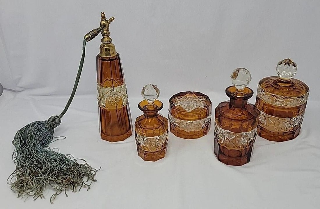 Bohemian Cut Glass Amber & Clear Perfume Vanity: Heavy Bohemian vanity / dresser set of 5. Attributed to Val St Lambert, but they are not signed. The chips on the larger bottle are only ones that show at a distance. Consists of:Tall perfume with ato